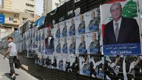 Affiches électorales pour le scrutin législatif qui doit se tenir le 6 mai au Liban, dans un quartier de Beyrouth, le 3 avril [Anwar AMRO / AFP/Archives]