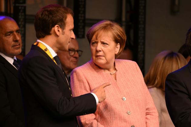 Le président français Emmanuel Macron avec la chancelière allemande Angela Merkel à Aix-la-Chapelle, le 10 mai 2018 [PATRIK STOLLARZ                      / AFP]