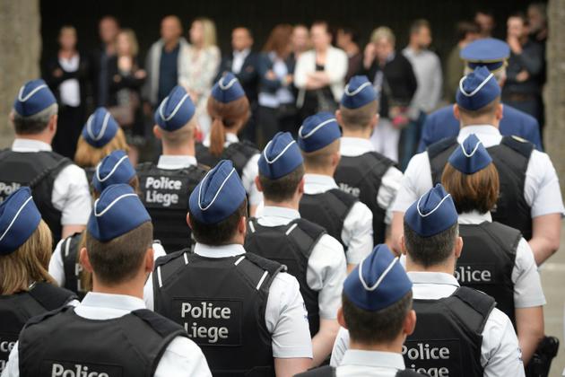 Des policiers participent à la cérémonie funèbre pour rendre hommage aux policières tuées à Liège, en Belgique, le 5 juin 2018 [YORICK JANSENS / BELGA/AFP]