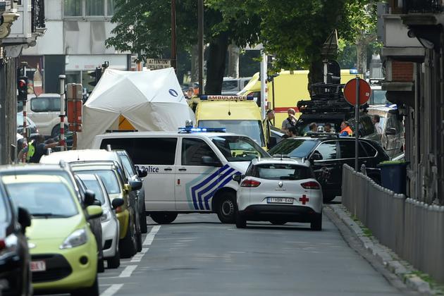 Des véhicules de police et des ambulances dépêches sur les lieux où un assaillant a tué trois personnes à Liège le 28 mai 2018 avant d'être abattu par les policiers. [JOHN THYS                  / AFP]