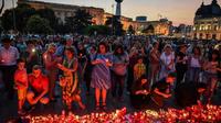 Veillée le 27 juillet 2019 à Bucarest en mémoire d'Alexandra, une fillette dont l'enlèvement et le meurtre ont profondément ému le pays provoquant le limogeage du chef de la police [Daniel MIHAILESCU / AFP]