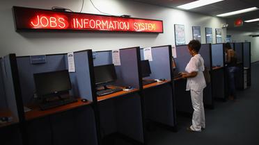 Une personne utilise un ordinateur dans une agence pour l'emploi, le 5 octobre 2012 à Hollywood en Floride [Joe Raedle / AFP/Getty Images]