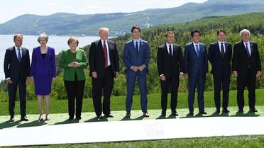 Donald Tusk, Theresa May, Angela Merkel, Donald Trump, Justin Trudeau, Emmanuel Macron, Shinzo Abe, Giuseppe Conte et Jean-Claude Juncker lors du sommet du G7 en juin 2018 à La Malbaie, au Canada. 