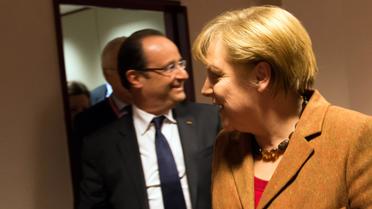 François Hollande et Angela Merkel à l'issue d'une rencontre bilatérale en marge d'un sommet le 22 novembre 2012 à Bruxelles [Bertrand Langlois / AFP/Archives]