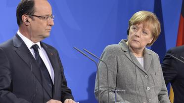 Le président français François Hollande (g) et la chancelière allemande Angela Merkel, le 18 mars 2013 à Berlin [Odd Andersen / AFP/Archives]