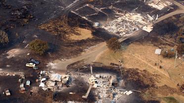 Vue aérienne d'une propriété détruite par un incendie en Tasmanie, le 5 janvier 2013 [Chris Kidd / Pool/AFP]