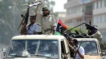 Des rebelles libyens, le 27 août 2011 près de Tripoli [Filippo Monteforte / AFP/Archives]