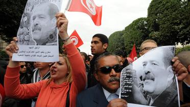 Des manifestants brandissent des portraits de Chokri Belaïd, le 23 février 2013 à Tunis [Fethi Belaid / AFP/Archives]