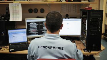 Un gendarme de la brigade de répression de la cybercriminalité, en février 2011 à Dijon [Jeff Pachoud / AFP/Archives]
