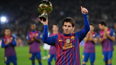 Le triple Ballon d'Or argentin du FC Barcelone Lionel Messi, lors de la présentation du trophée au Camp Nou, le 15 janvier 2012 à Barcelone. [Lluis Gene / AFP/Archives]