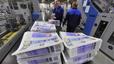 Des exemplaires du quotidien Le Soir dans une imprimerie de Bruxelles, le 24 janvier 2013 [Georges Gobet / AFP/Archives]