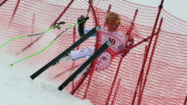 Chute spectaculaire du skieur autrichien Klaus Kröll, le 14 mars 2013 à Lenzerheide, en Suisse [Fabrice Coffrini / AFP]