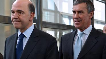 Le ministre de l'Economie Pierre Moscovici (G) et Jérôme Cahuzac (D), le 20 mars 2013 à Paris [Miguel Medina / AFP/Archives]