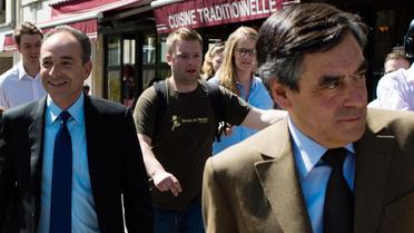 L'ancien Premier ministre François Fillon (d) et le président de l'UMP Jean-françois Copé à la sortie d'un déjeuner le 24 avril 2013 à Paris [Martin Bureau / AFP]