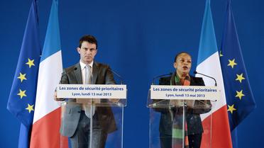 Manuel Valls et Christiane Taubira le 13 mai 2013 à Lyon [Philippe Merle / AFP]