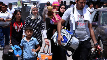 Des familles fuient le nord de l'Irak à l'arrivée des jihadistes de l'EIIL