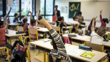 Des élèves dans une école primaire à Lyon [Jeff Pachoud / AFP/Archives]