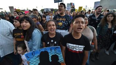 Des manifestants contre la séparation des enfants de leurs parents sans-papiers le 14 juin 2018 à Los Angeles [Robyn Beck / AFP/Archives]