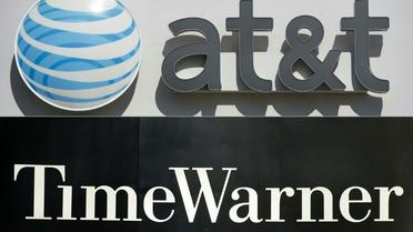 Photo montage des sigles de AT & T et Time Warner qui ont annoncé leur fusion [SAUL LOEB, STAN HONDA / AFP]