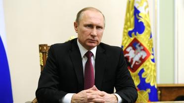 Le président russe Vladimir Poutine annonce un accord avec les Etats-Unis pour renforcer le cessez-le-feu en Syrie, dans son bureau près de Moscou, le 22 février 2016 [MICHAEL KLIMENTYEV / SPUTNIK/AFP/Archives]