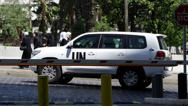 Des enquêteurs de l'ONU, chargés de déterminer la responsabilité d'attaques à l'arme chimique en Syrie, arrivent à Damas, le 18 août 2013 [LOUAI BESHARA / AFP/Archives]