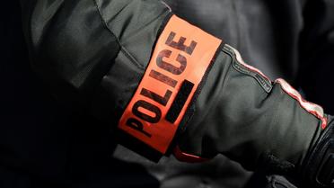 Un brassard de police à Saint-Denis, le 29 juin 2018 [Bertrand GUAY / AFP/Archives]