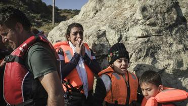 Des réfugiés syriens à leur arrivée sur l'île grecque de Lesbos, le 23 août 2015  [ACHILLEAS ZAVALLIS / AFP]