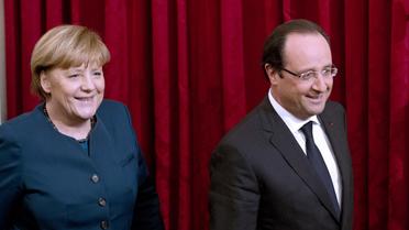 La chancelière allemande Angela Merkel et le président français François Hollande, le 18 décembre 2013 à l'Elysée, à Paris [Alain Jocard / AFP/Archives]