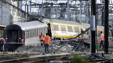 Wagons enchevétrés après de déraillage du Paris-Limoges le 14 juillet 2014 en gare de Brétigny-sur-Orge [Kenzo Tribouillard / AFP/Archives]