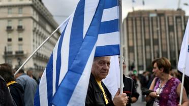 L'agence de notation financière Moody's a relevé vendredi d'un cran la note de la dette de long terme de la Grèce, passée de "Caa3" à "Caa2", et a également revu sa perspective à "positive" contre "stable" précédemment [ARIS MESSINIS / AFP]
