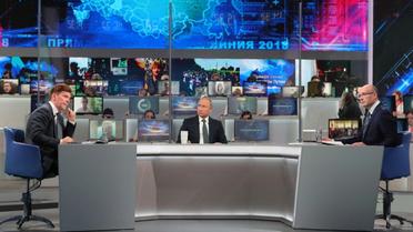 Le président russe Vladimir Poutine lors de son intervention télévisée, "Ligne directe", le 7 juin 2018  [Mikhail KLIMENTYEV / SPUTNIK/AFP]