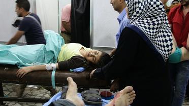 Des civils blessés dans les bombardements, soignés le 13 octobre 2016 dans un hôpital d'un quartier d'Alep tenu par les forces pro-régime  [GEORGE OURFALIAN / AFP]