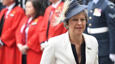 La Première ministre britannique Theresa May arrive le 10 juillet 2018 à l'abbaye de Westminster pour une messe célébrant le centenaire de la Royal Air Force (RAF). [Chris J Ratcliffe / AFP]