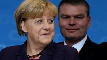 La chancelière allemande Angela Merkel et le ministre de l'Intérieur de Saxe-Anhalt Holger Stahlknecht à Magdebourg le 17 septembre 2013 [RONNY HARTMANN / AFP/Archives]