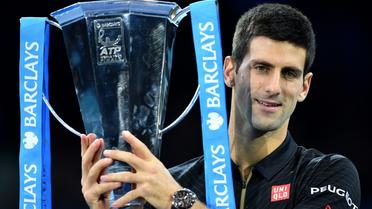 Le Serbe Novak Djokovic après sa victoire dans la précédente édition du Masters de Londres, le 16 novembre 2014 [LEON NEAL / AFP/Archives]