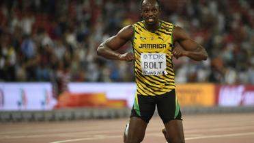 Le Jamaïcain Usain Bolt célèbre son titre de champion du monde du 200 m, à Pékin le 27 août 2015 [Olivier Morin / AFP]