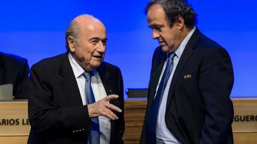 Joseph Blatter et Michel Platini le 11 juin 2014 à Sao Paulo [Fabrice Coffrini / AFP/Archives]