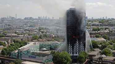 La tour Grenfell détruite par un incendie, le 14 juin 2017 à Londres [Adrian DENNIS / AFP/Archives]