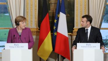 Le président Emmanuel Macron et la Chancelière allemande Angela Merkel lors d'une conférence de presse, le 16 mars 2018 à l'Elysée, à Paris [ludovic MARIN / POOL/AFP]