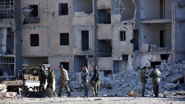 Des soldats du régime syrien dans le quartier Masaken Hanano, le 27 novembre 2016 à Alep [GEORGE OURFALIAN / AFP]
