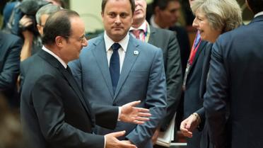 Le président Hollande et la Première ministre britannique Theresa May pendant le sommet européen à Bruxelles le 20 octobre 2016 [JOHN THYS / AFP]