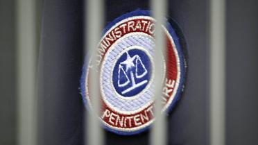 Un badge de l'administration pénitentiaire   [Jean-Philippe Ksiazek / AFP/Archives]