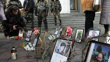 Portraits de manifestants tués sur la place Maidan, à Kiev, le 26 février 2014 [Anatolii Boiko / AFP/Archives]