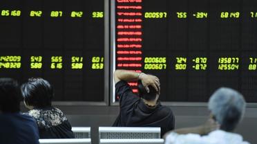 Une société de Bourse à Pékin le 25 août 2015 [FRED DUFOUR / AFP]