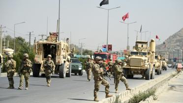 Des forces de sécurité afghanes et des soldats américains, le 24 septembre 2017 à Kaboul [WAKIL KOHSAR / AFP/Archives]