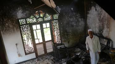 Une maison endommagée à la suite d'affrontements entre musulmans et extrémistes bouddhistes le 17 juin 2014 dans la localité de Alutgama, dans le sud-ouest du Sri Lanka [Lakruwan Wanniarachchi / AFP]
