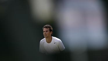 Adrian Mannarino lors de son match contre le  polonais Lukasz Kubot en huitièmes de finale de Wimbledon, le 1er juillet 2013 à Londres [ADRIAN DENNIS / AFP Photo]