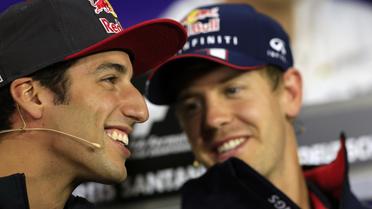 Daniel Ricciardo (g) et Sebastian Vettel en conférence de presse, le 4 juillet 2013 au Nürburgring avant le Grand Prix d'Allemagne [Alexander Klein / AFP]