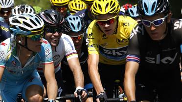 Mark Cavendish, Peter Kennaugh, Chris Froome et Geraint Thomas, dans le peloton lors de la 14e étape du Tour de France, le 13 juillet 2013 entre Saint-Pourçain-sur-Sioule et Lyon [Pascal Guyot / AFP]