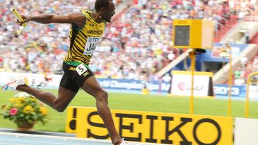 Usain Bolt remporte pour la Jamaïque l'or du relais 4x100m des Mondiaux de Moscou, le 18 août 2013 [Alexander Nemenov / AFP]